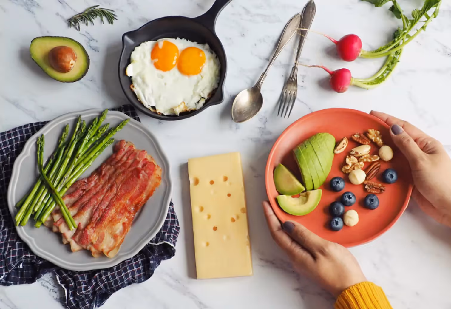 a spread of eggs, bacon, asparagus, cheese, etc