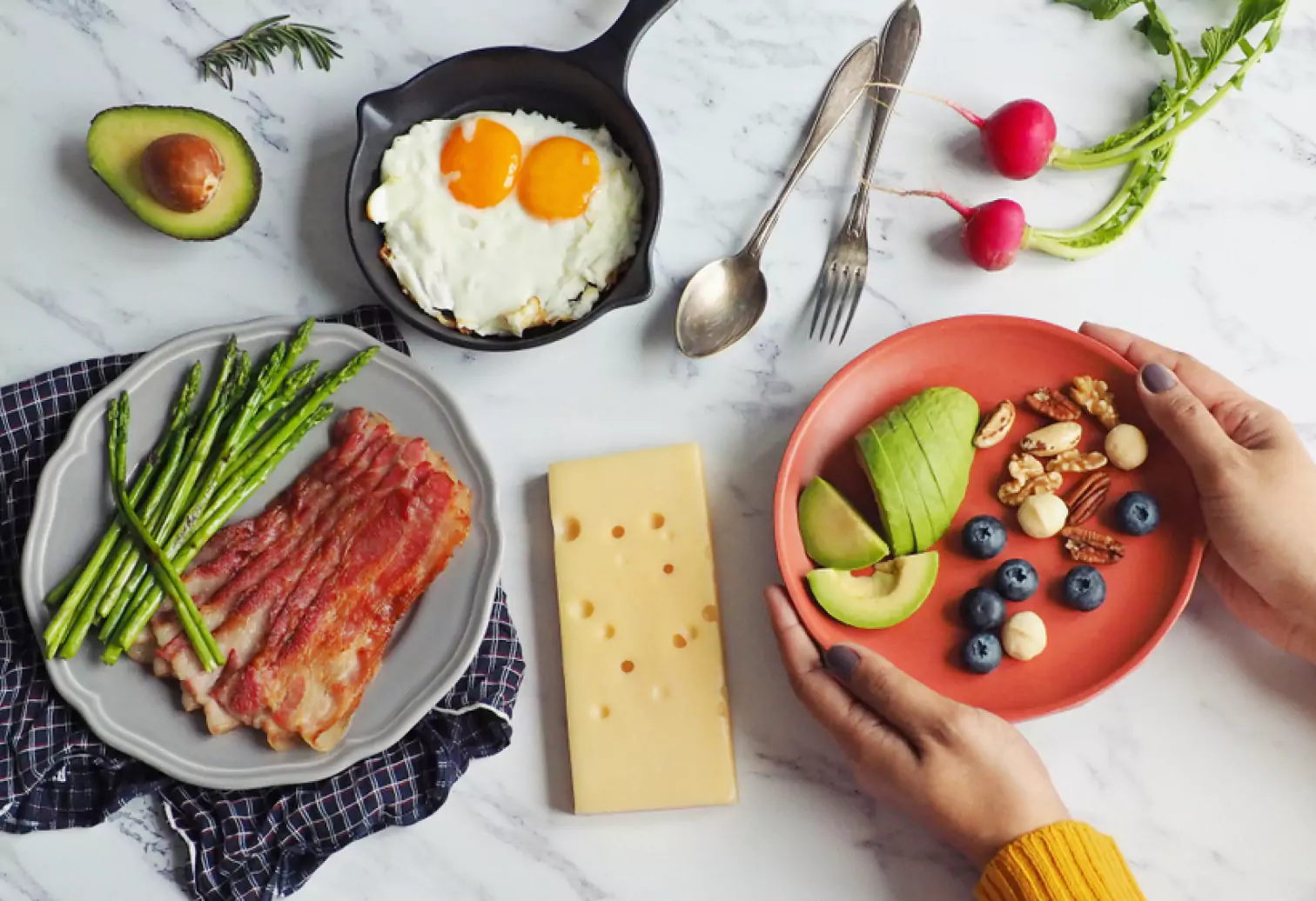 a spread of eggs, bacon, asparagus, cheese, etc