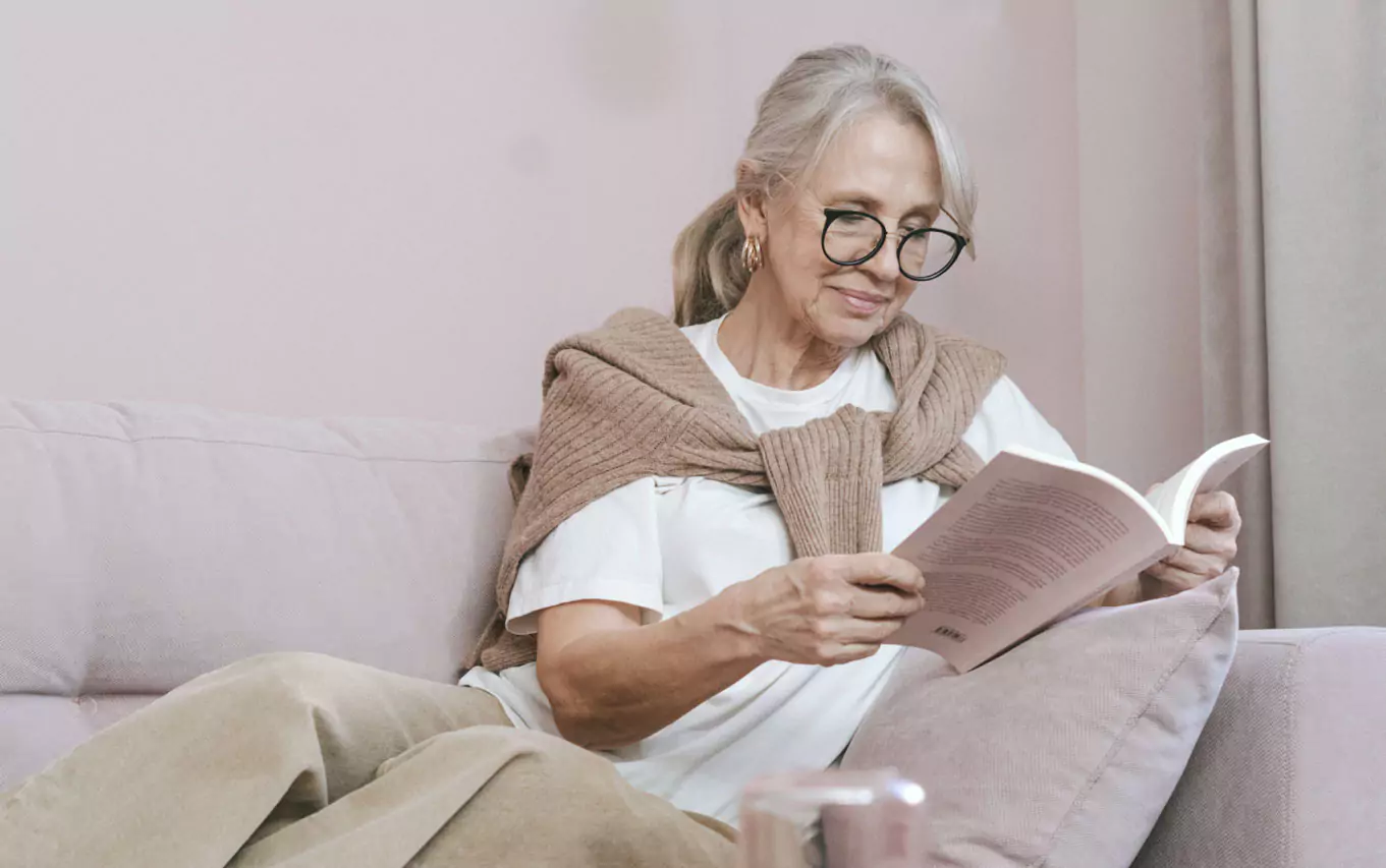 an older person reading a book