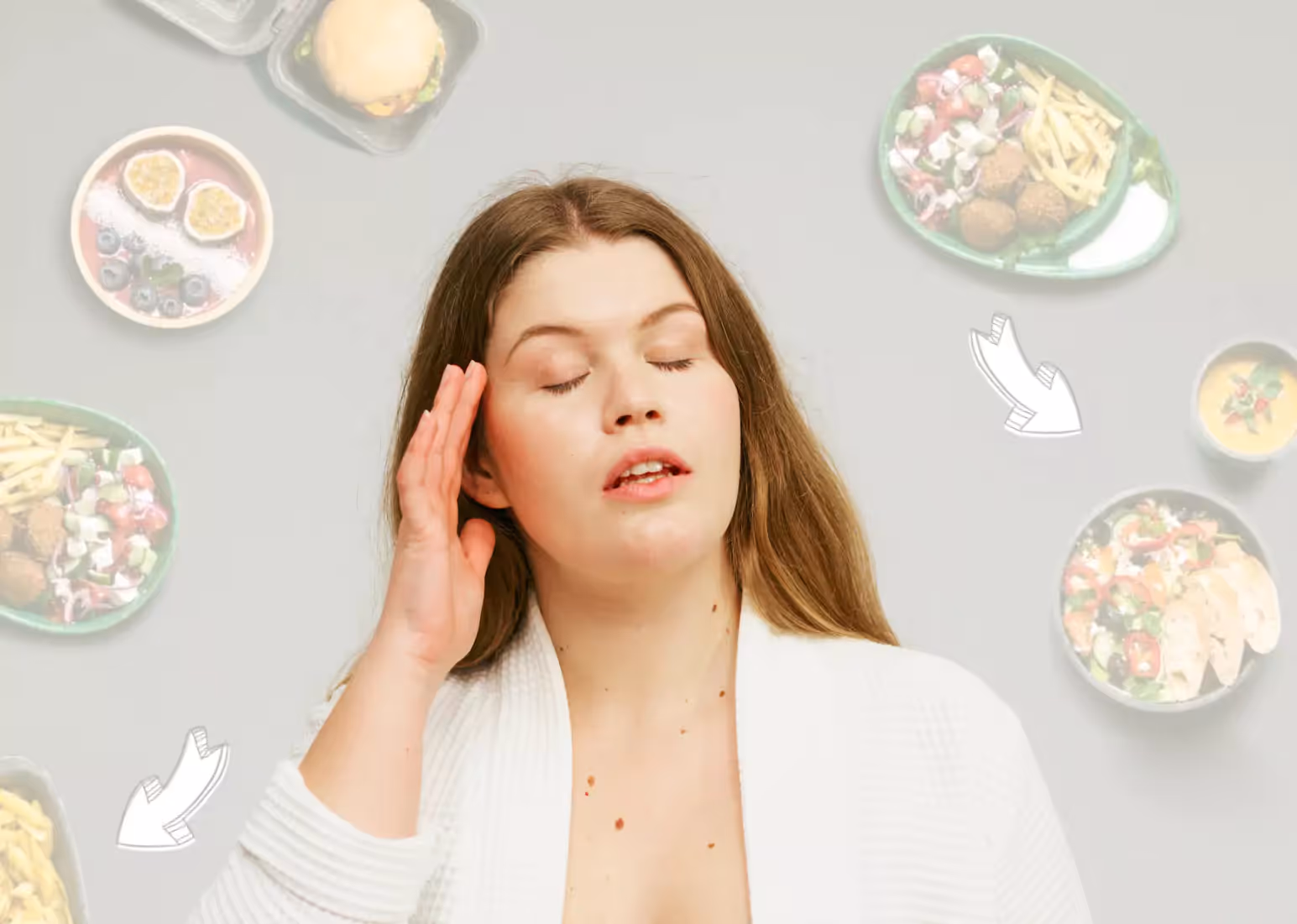 A woman with long brown hair surrounded by supplements