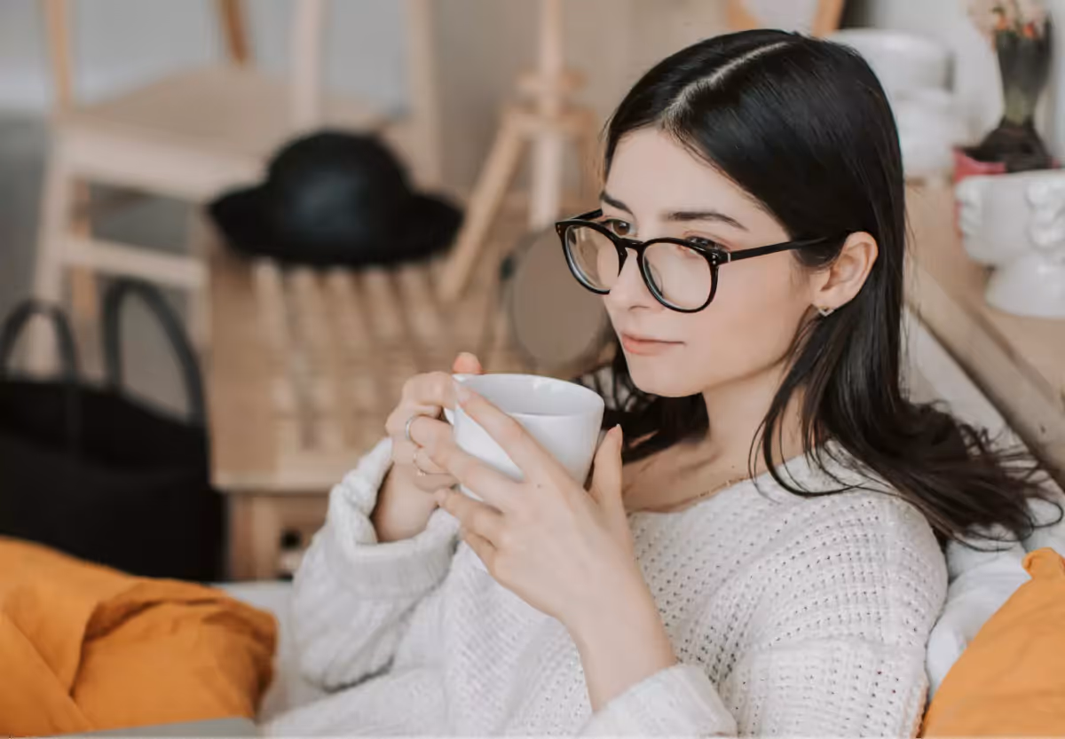 a girl drinking a hot cinnamon tea