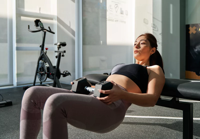 Woman dong dumbbell hip thurst