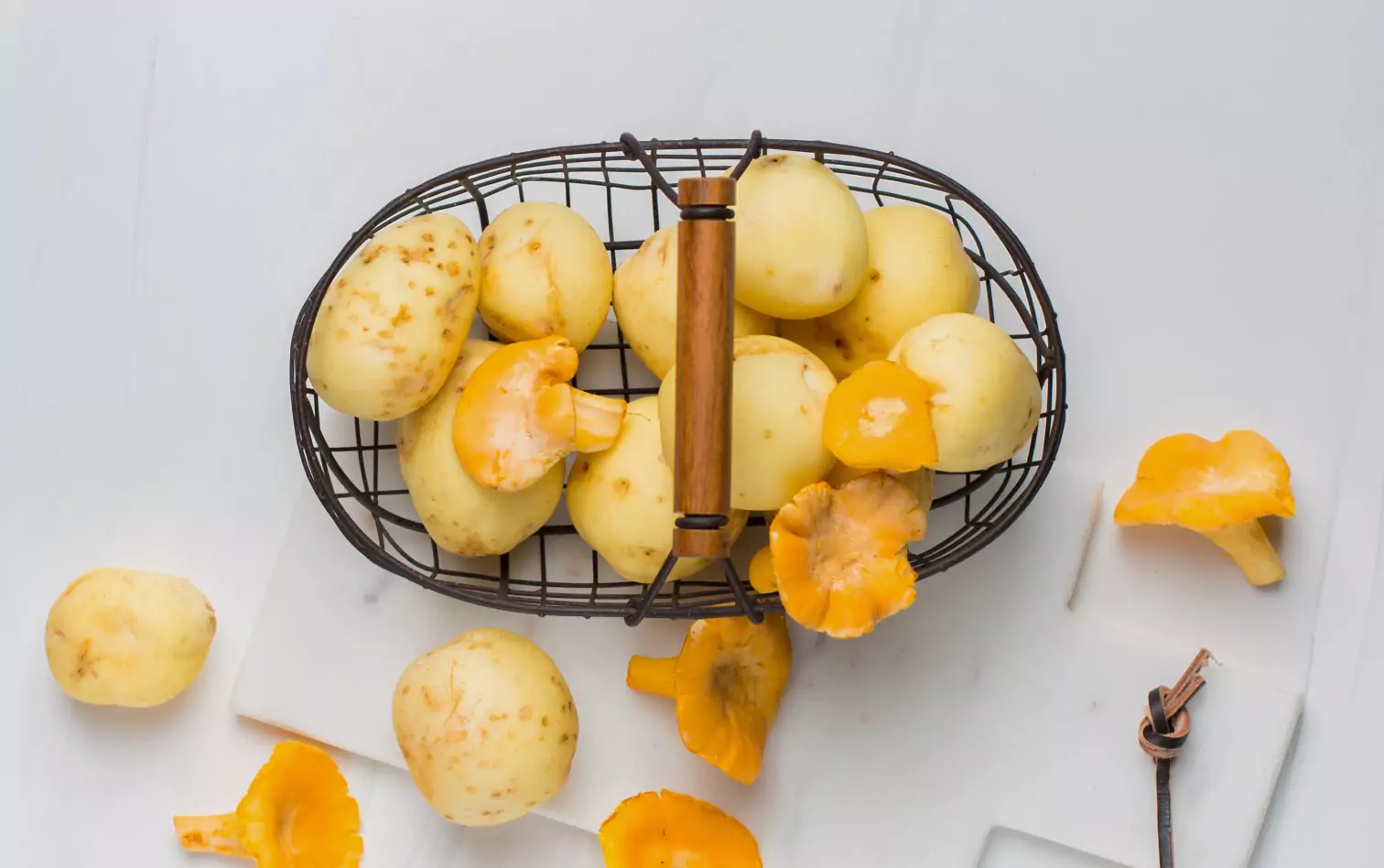 a basket of potatoes and mushrooms