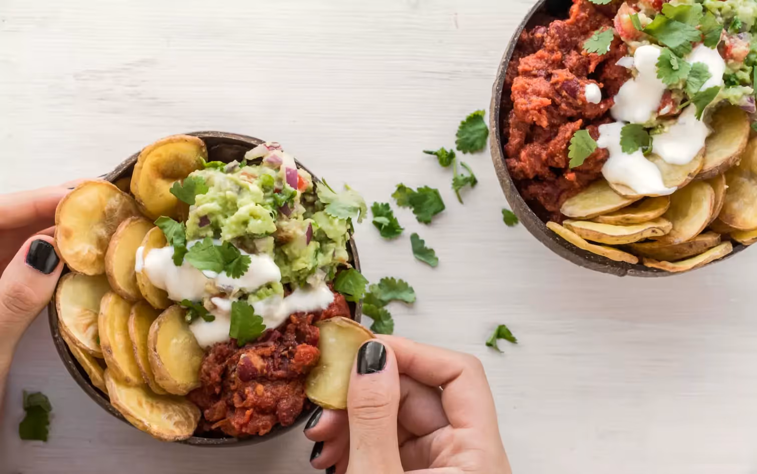 two bowls of baked potatoes 