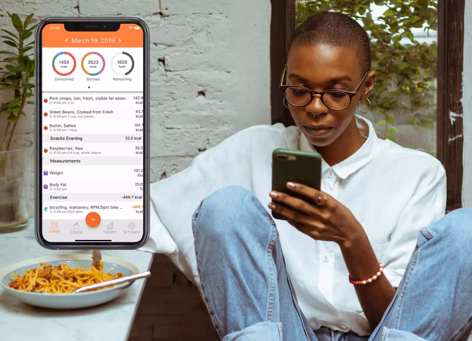 Cronometer app and a person eating pasta 