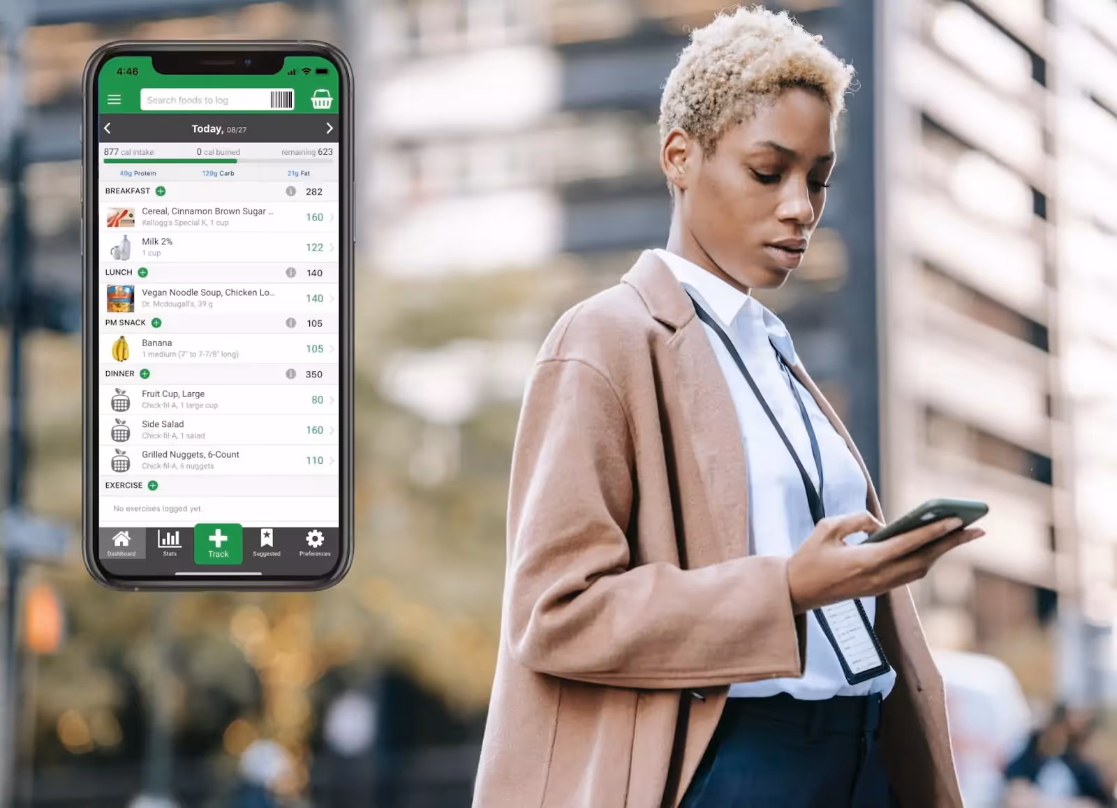 Nutritionix app and a person standing outdoors and looking at their phone