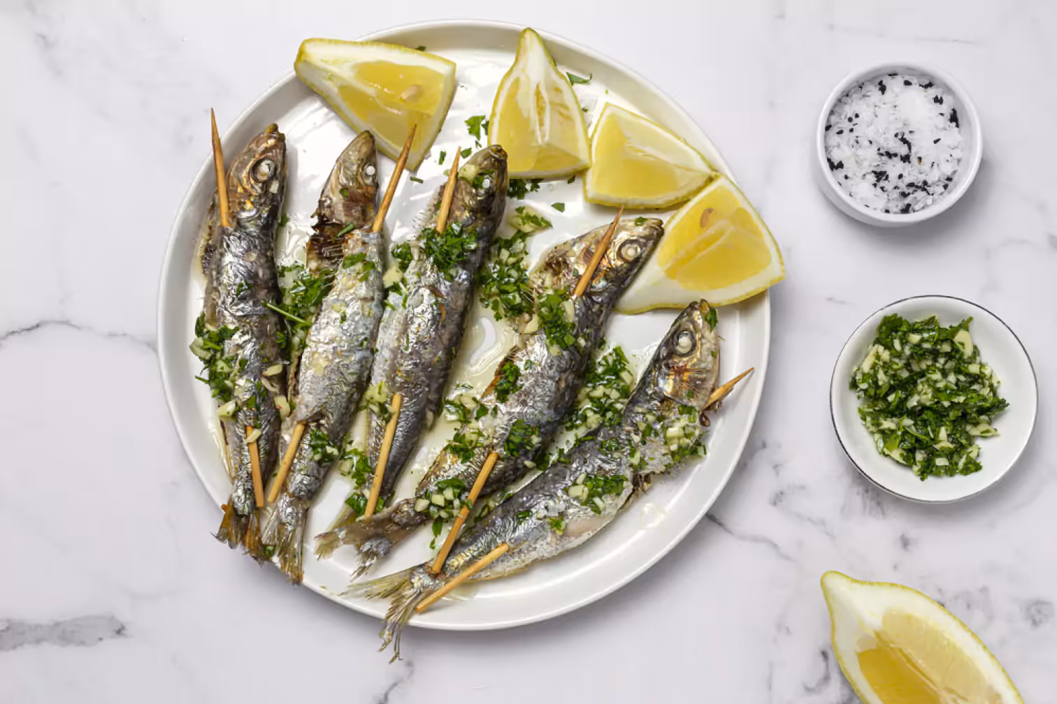 sardines and lemon on a plate