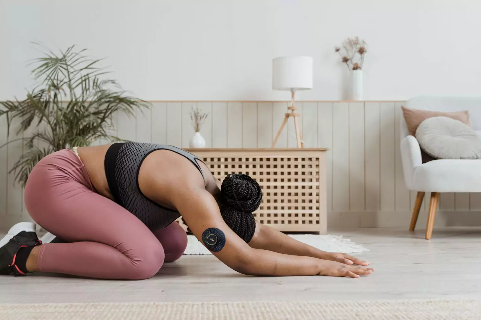someone doing yoga with a CGM