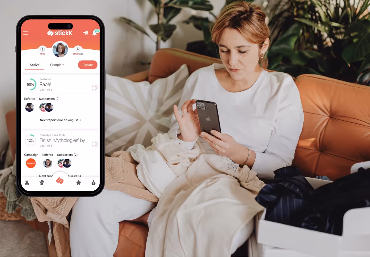 a woman using the stickK app