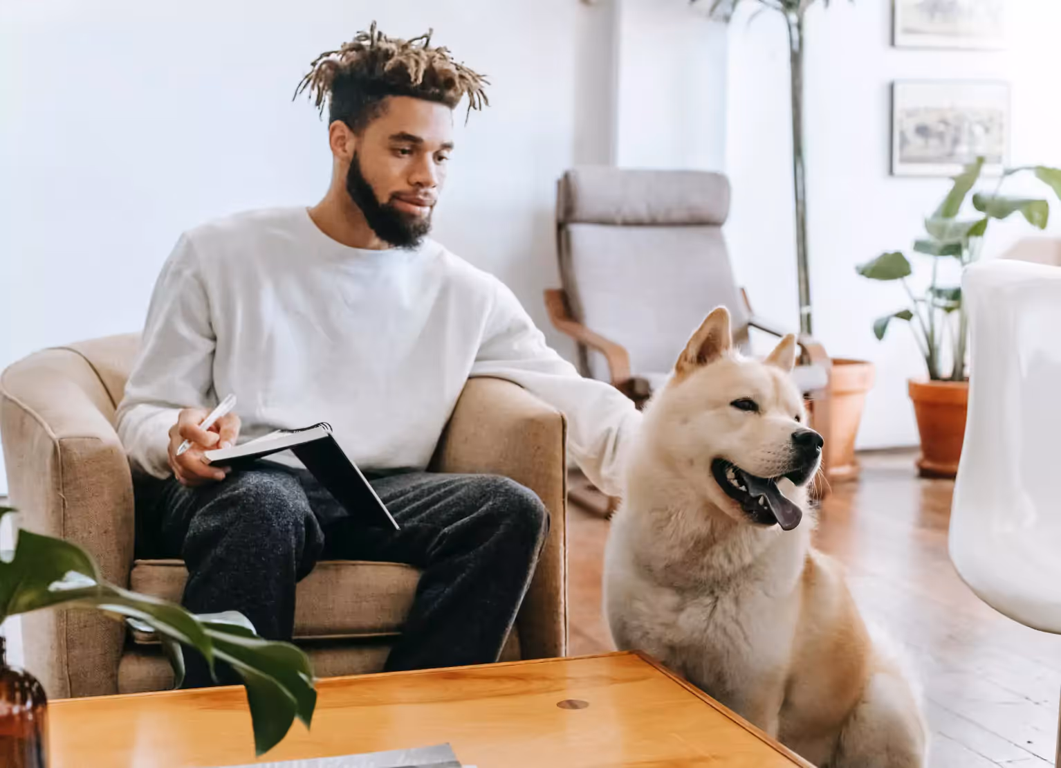 a man petting his dog