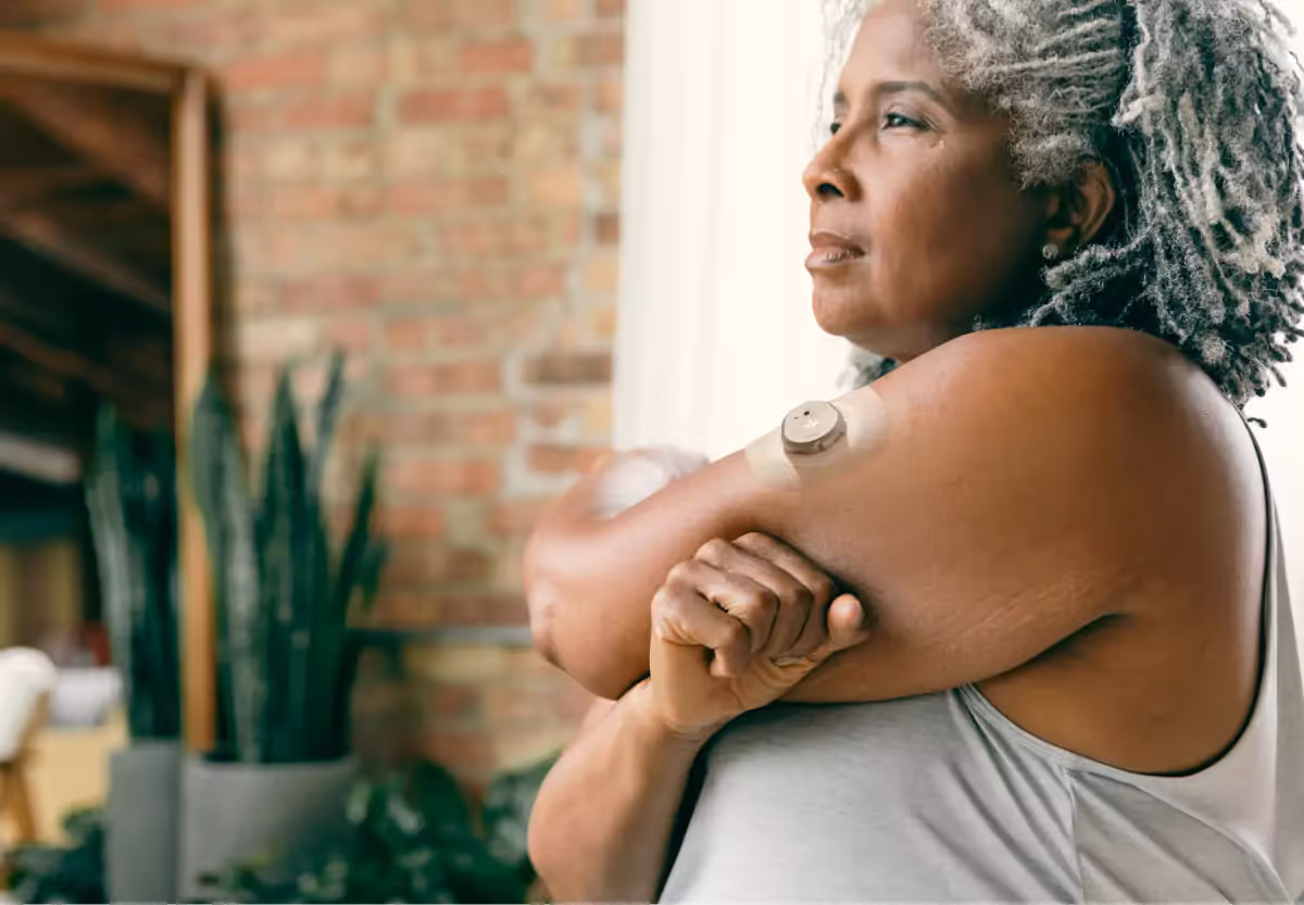 a woman with the nutrisense cgm