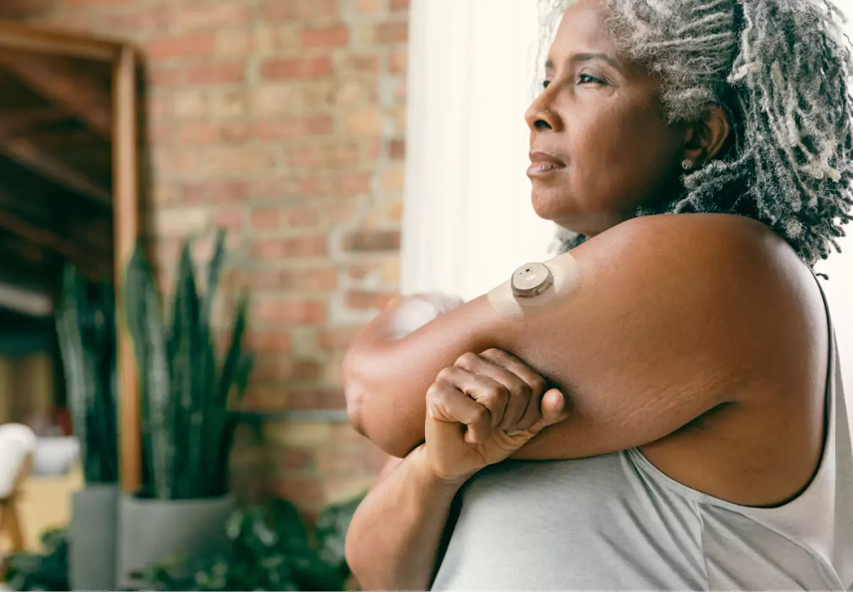 a woman with the nutrisense cgm