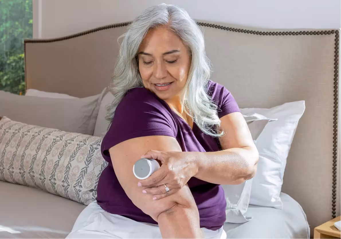 A woman applying her CGM