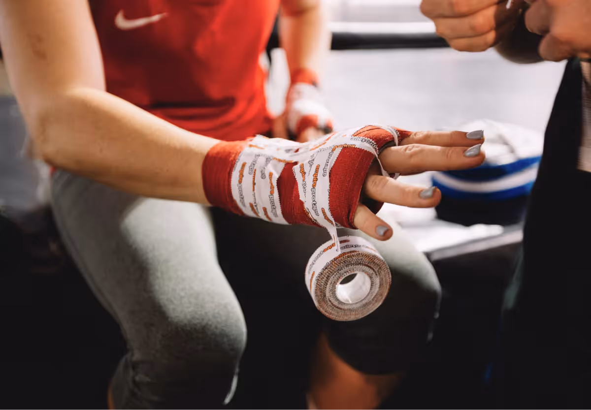 an athlete taping their hand