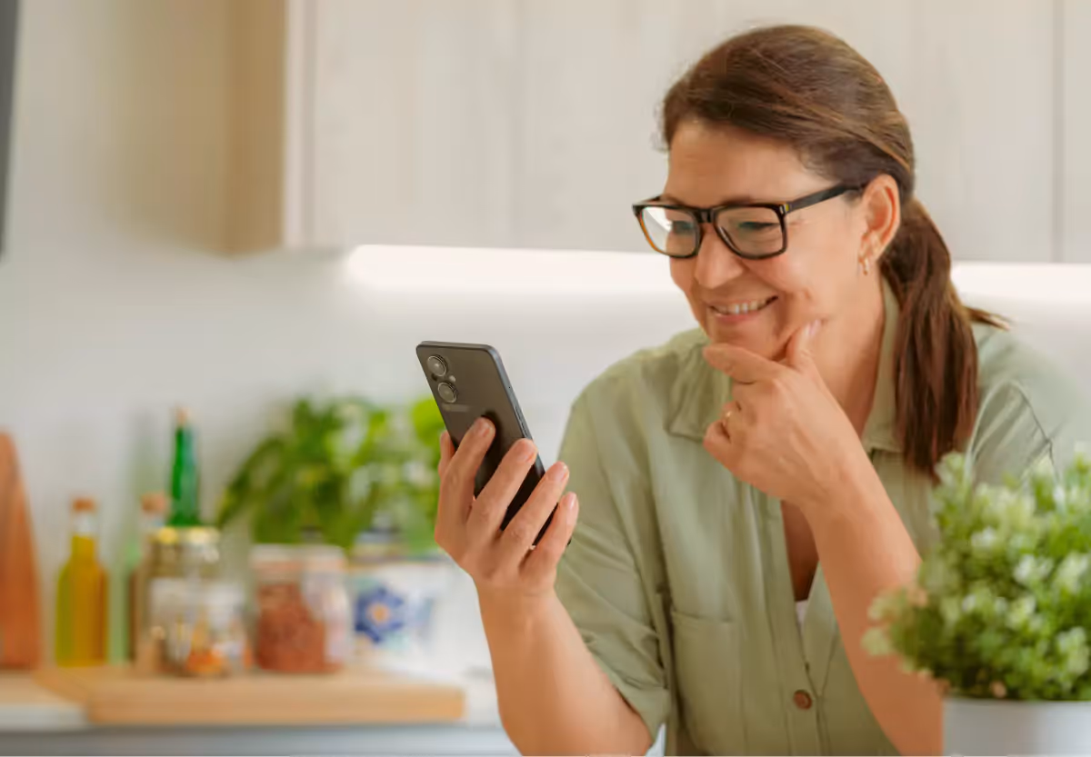 someone looking at the nutrisense app on their mobile phone 