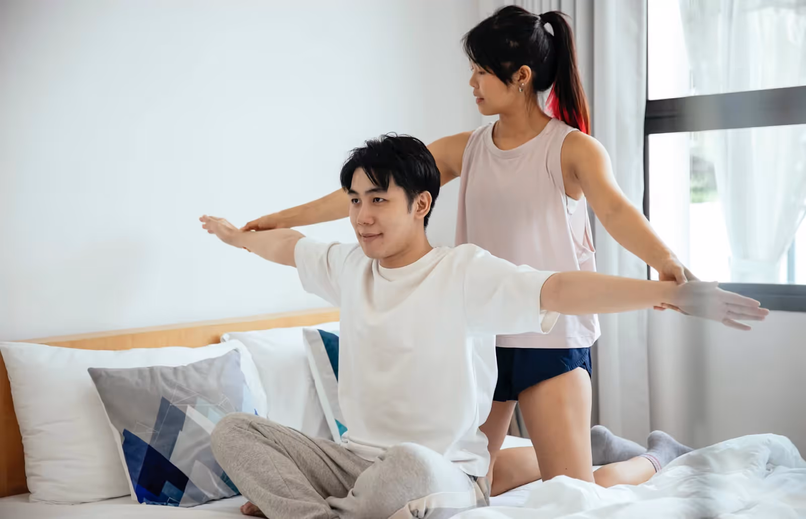 a couple of people doing exercises in the morning