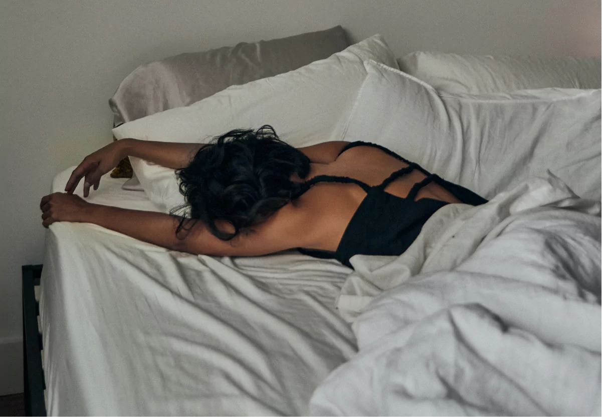 a girl laying in bed