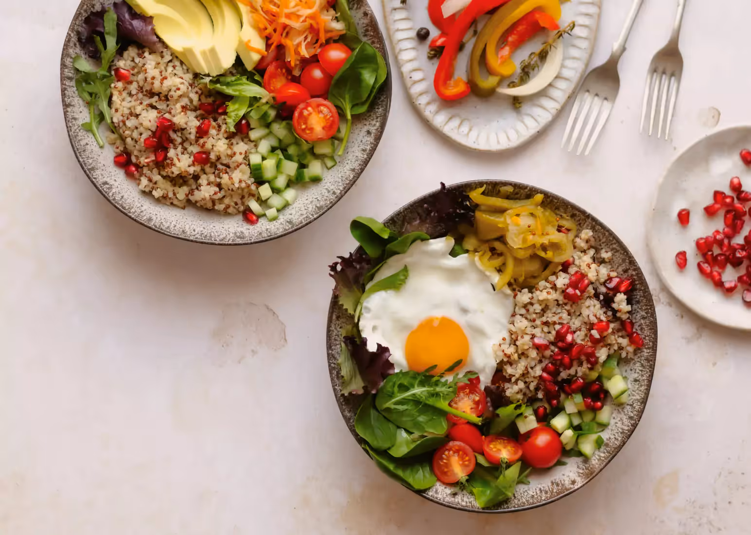 Bowls of fresh food with vegetables, grains, and protein in a balanced meal for hormonal health