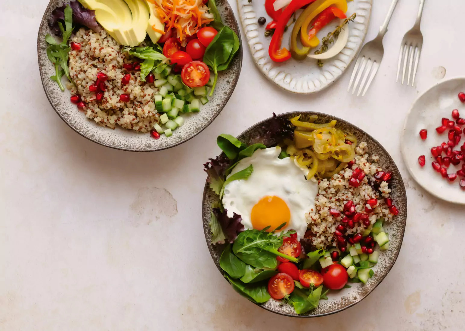 Bowls of fresh food with vegetables, grains, and protein in a balanced meal for hormonal health