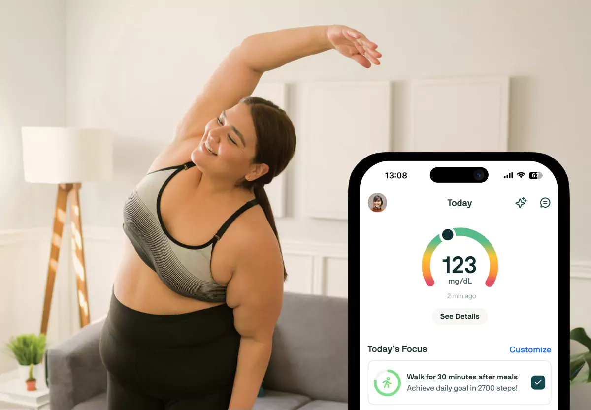 A person with long dark hair in workout clothes, stretching at home. Mobile screen of Nutrisense app overlaid