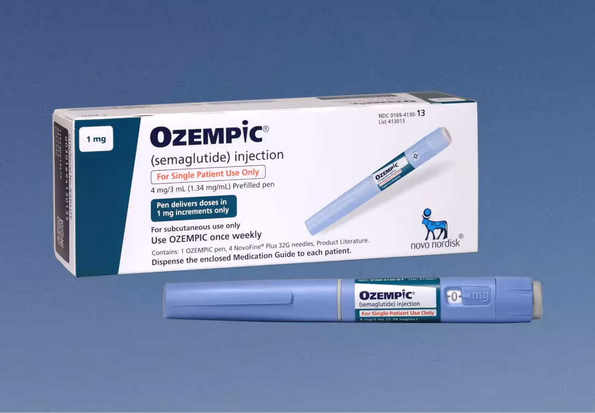 Box of weight loss medication ozempic on blue backdrop