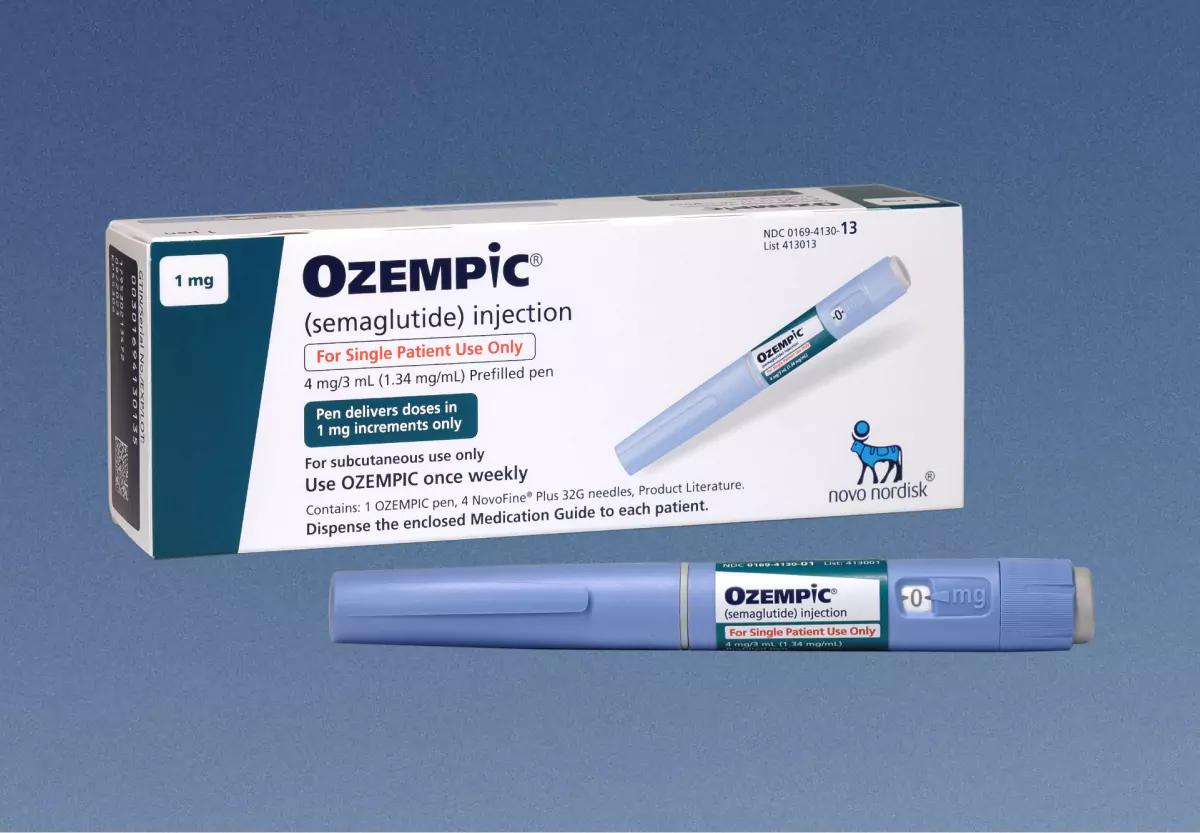 Box of weight loss medication ozempic on blue backdrop