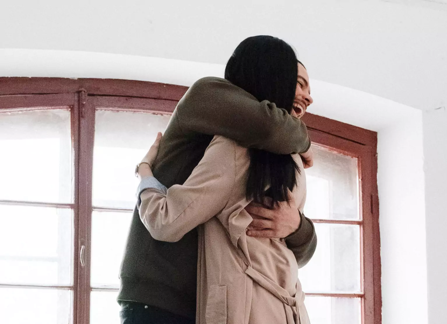 a couple of people hugging each other 