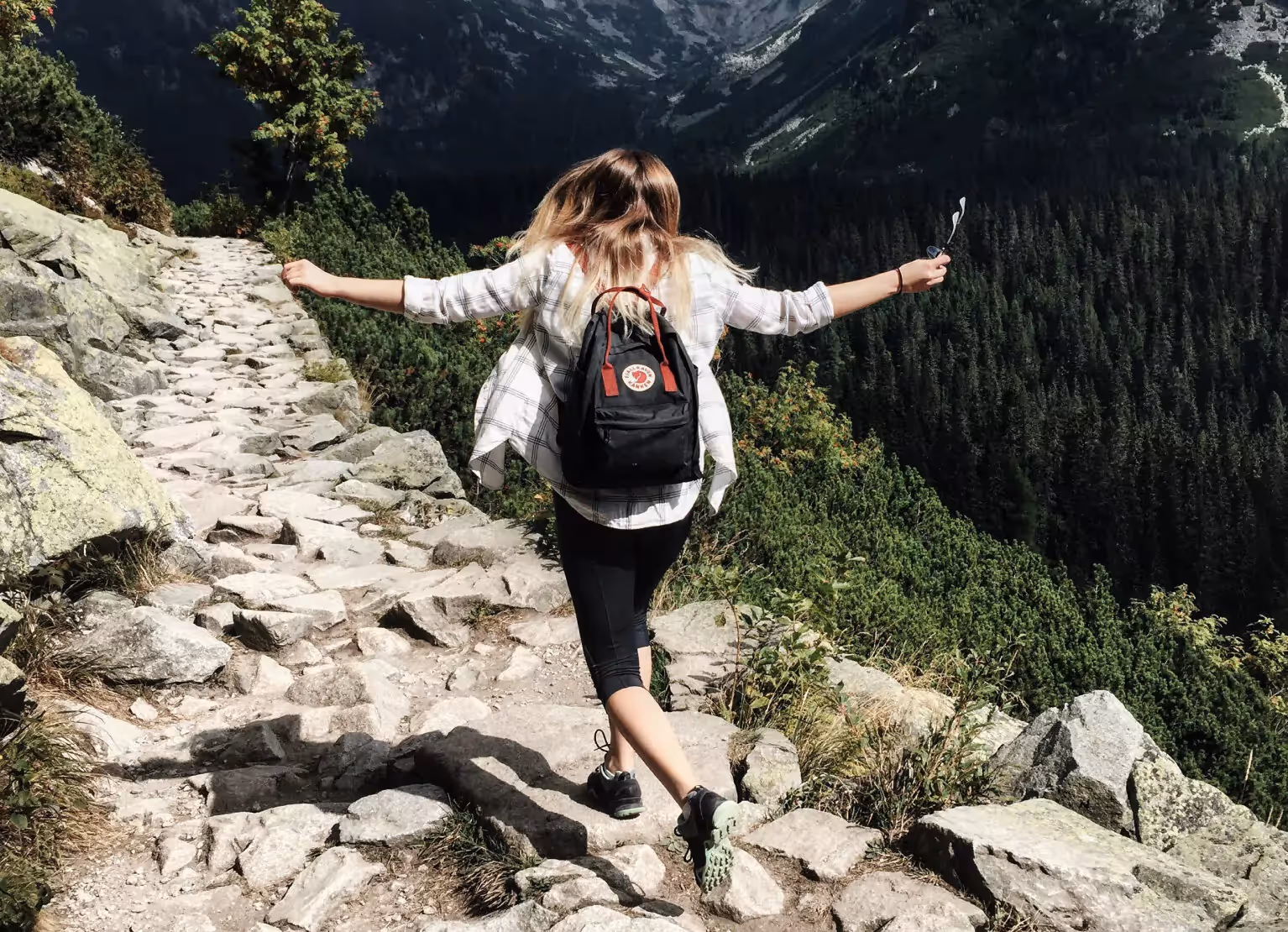 a person hiking in the mountains 