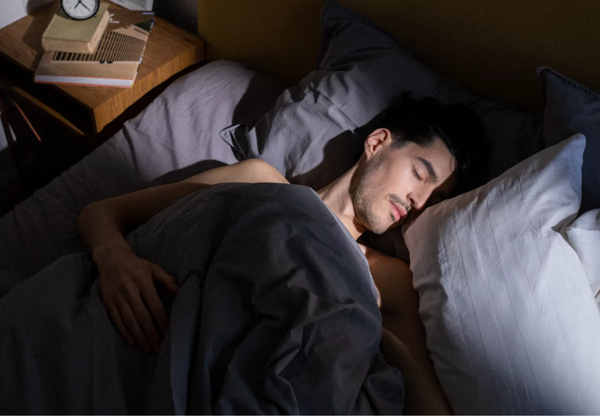 a man laying in bed asleep