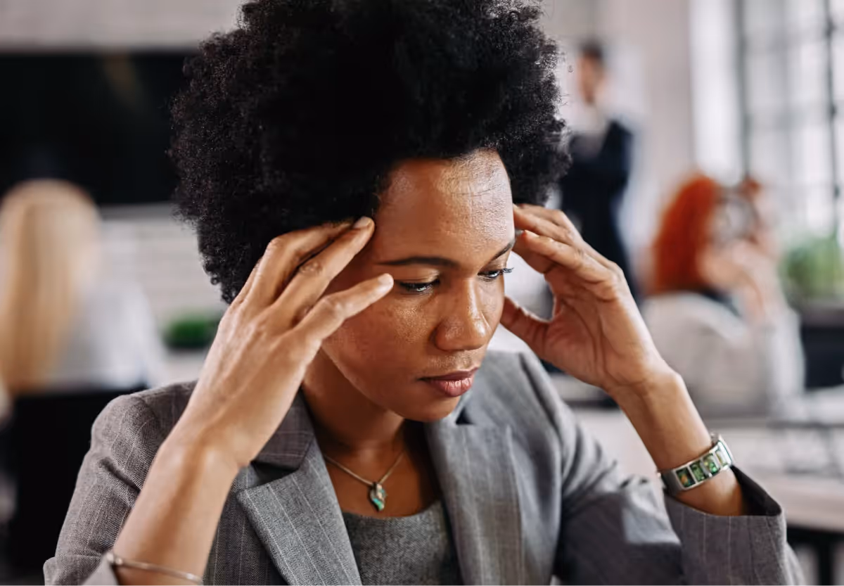 a woman holding her temples