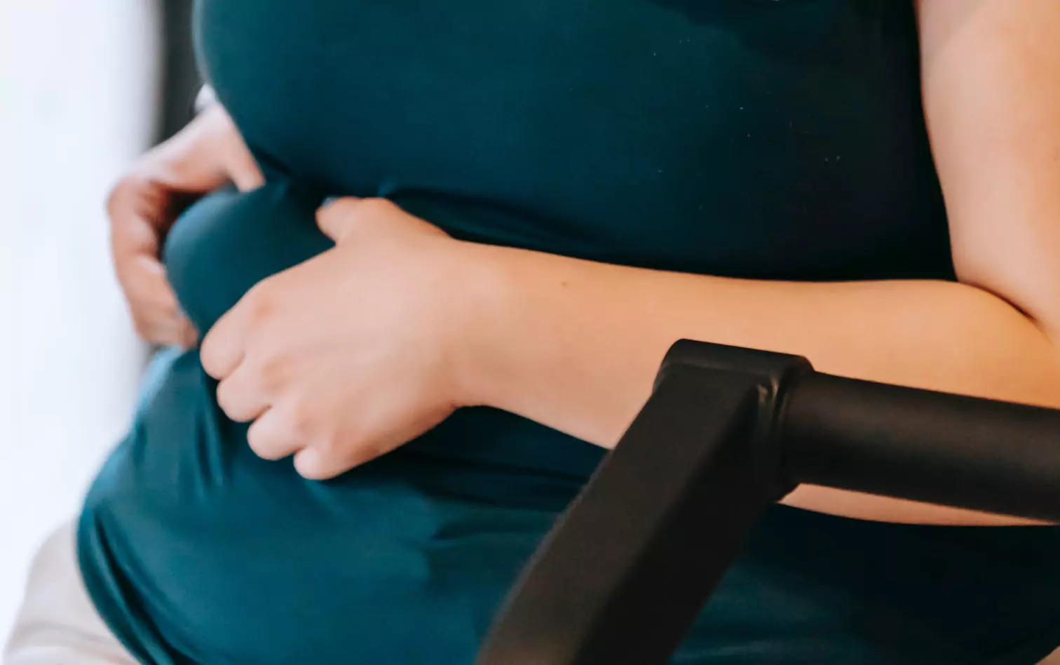 a person squeezing their stomach