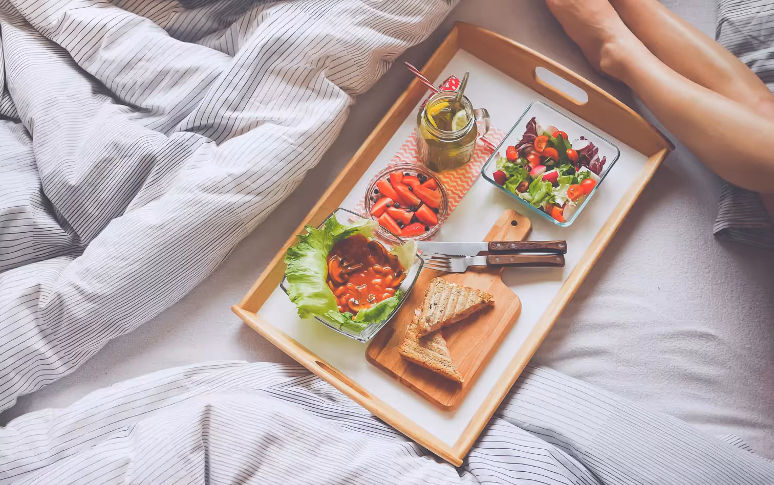 a person having breakfast in bed 