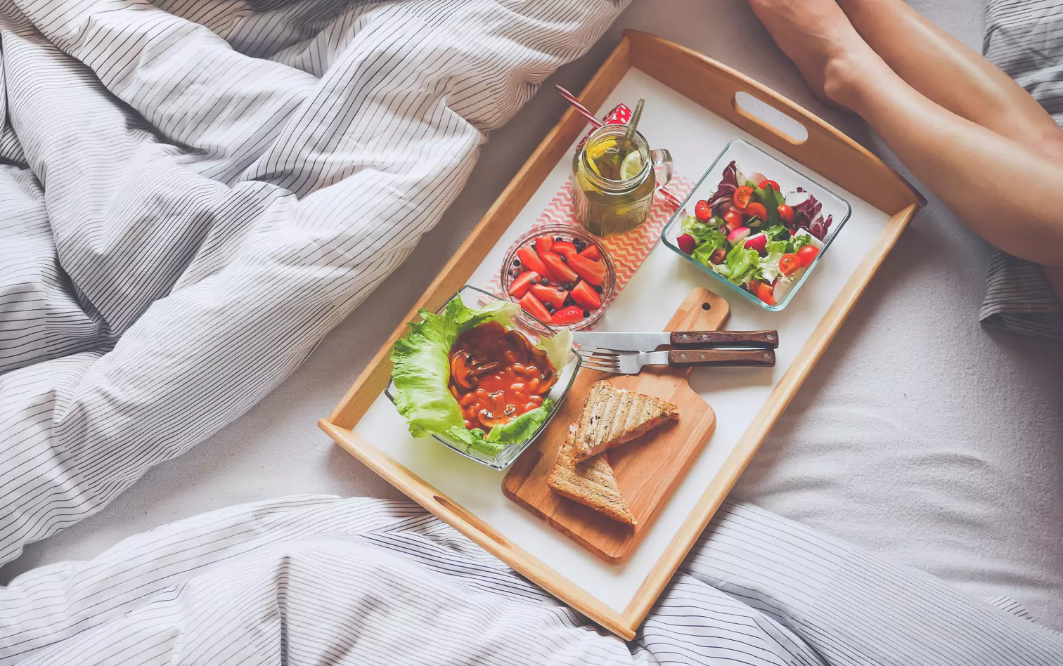 a person having breakfast in bed