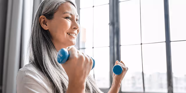 a person holding dumbbells