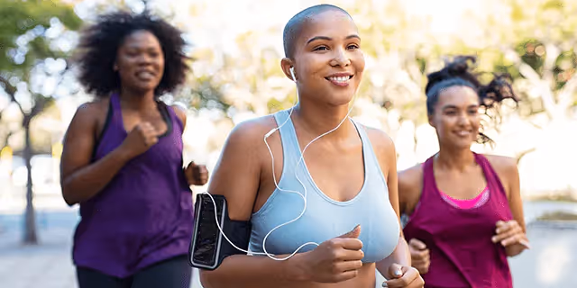 trio of people running outdoors