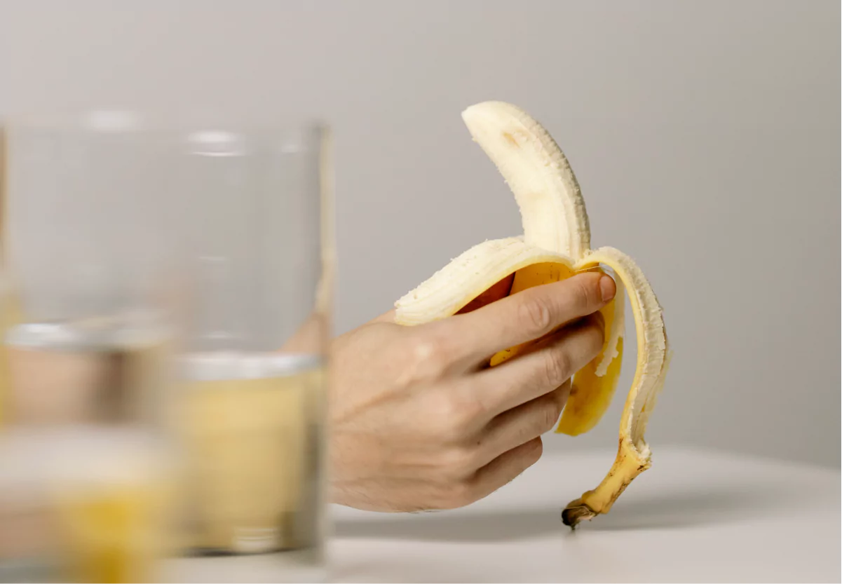 a photo of someone holding a banana