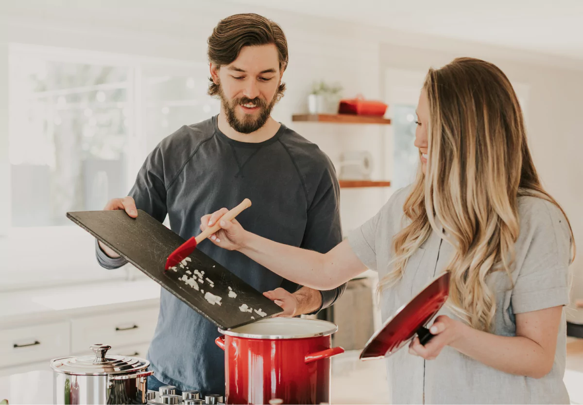 a couple cooking together at home