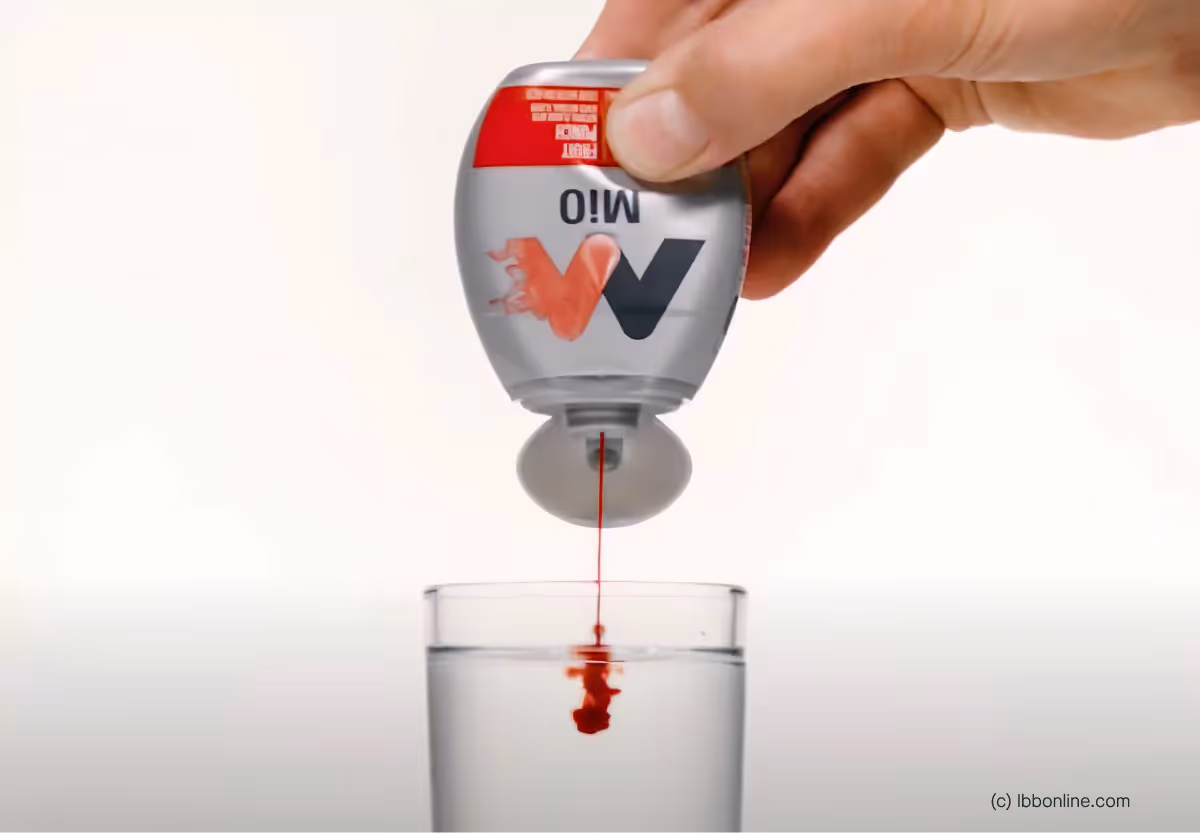 someone adding mio to water