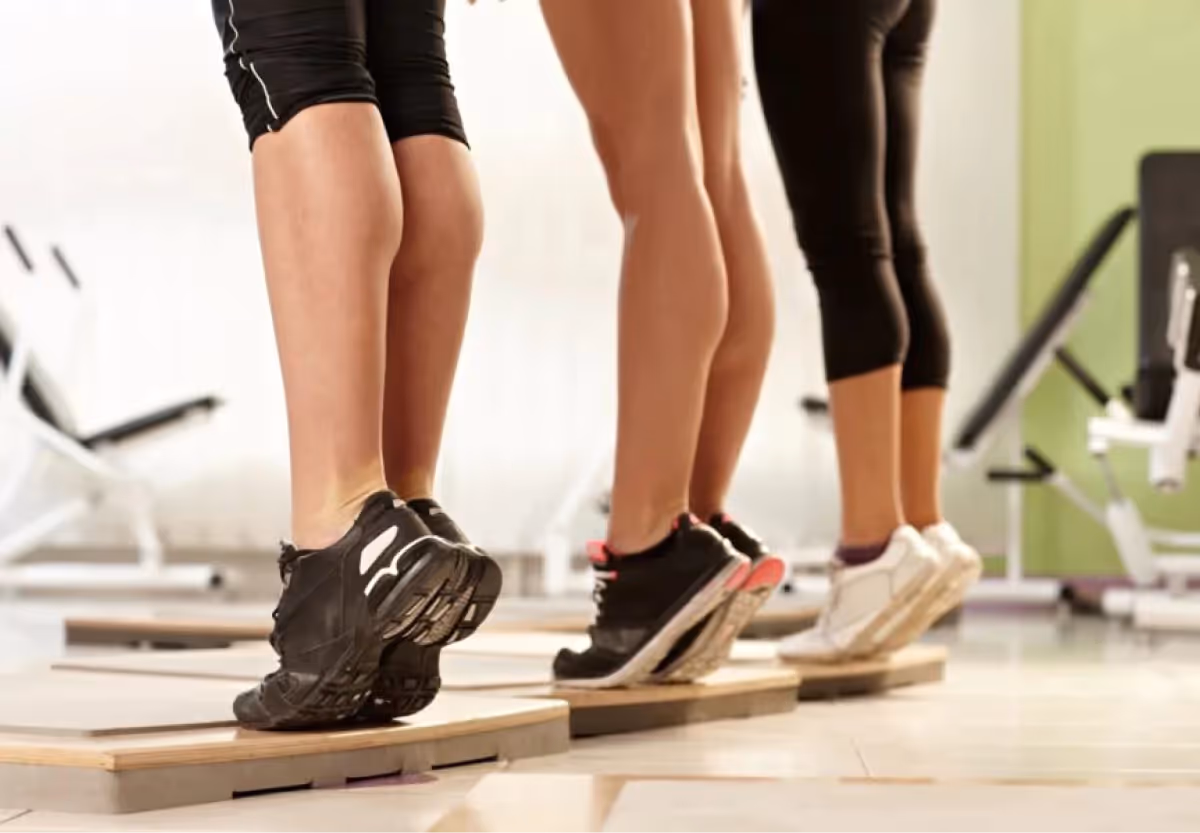 three people doing calf raises