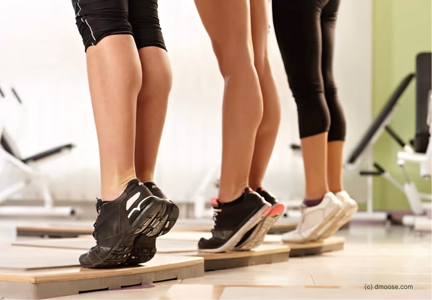 three people doing calf raises