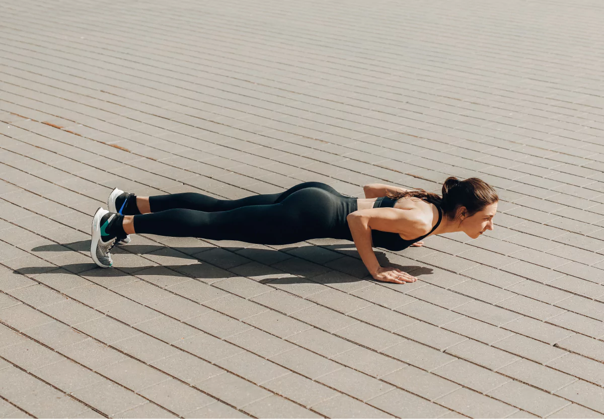 a woman doing push ups
