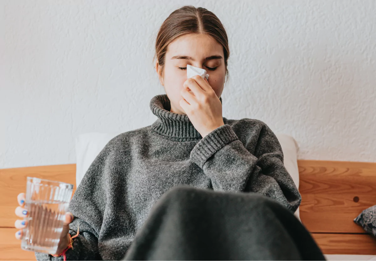 a girl blowing her nose