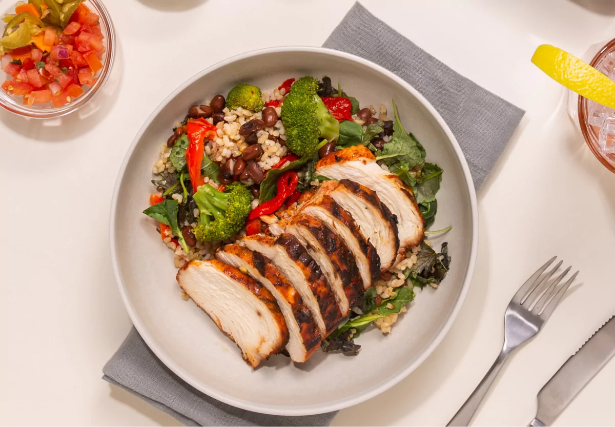 a plate of rice, beans, and chicken