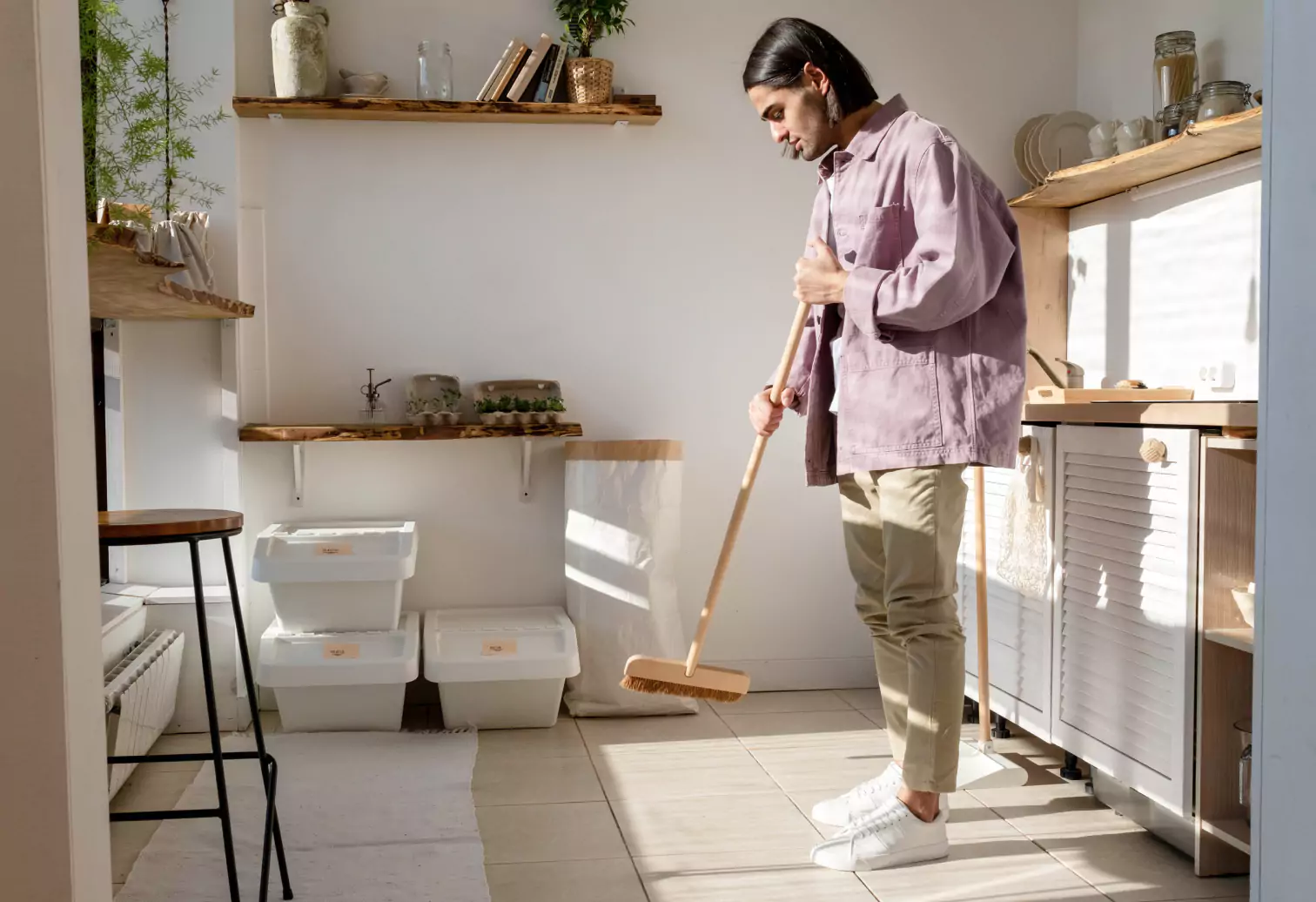 a person sweeping the floor