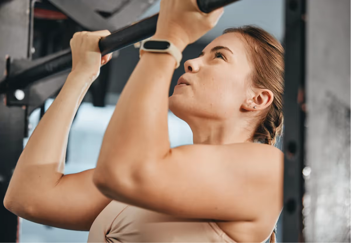 a girl doing a chin up