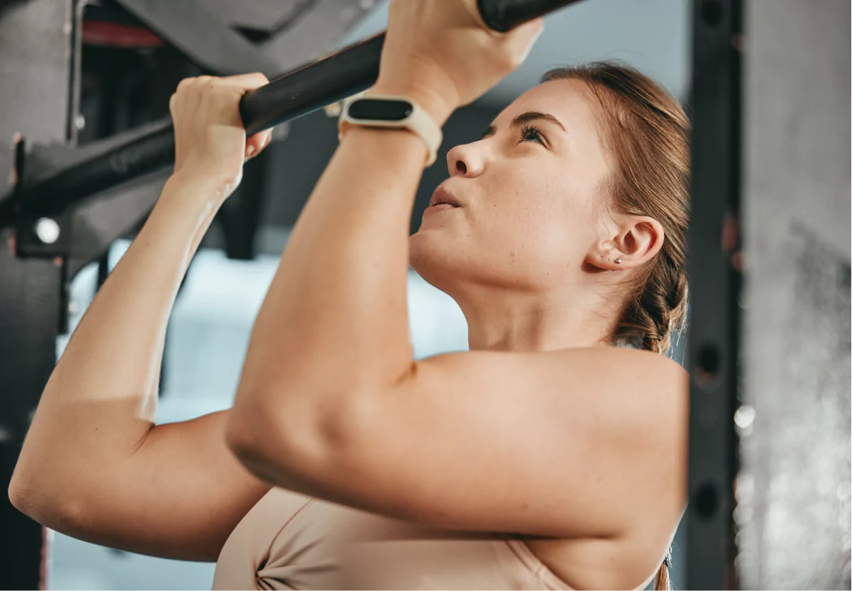 a girl doing a chin up