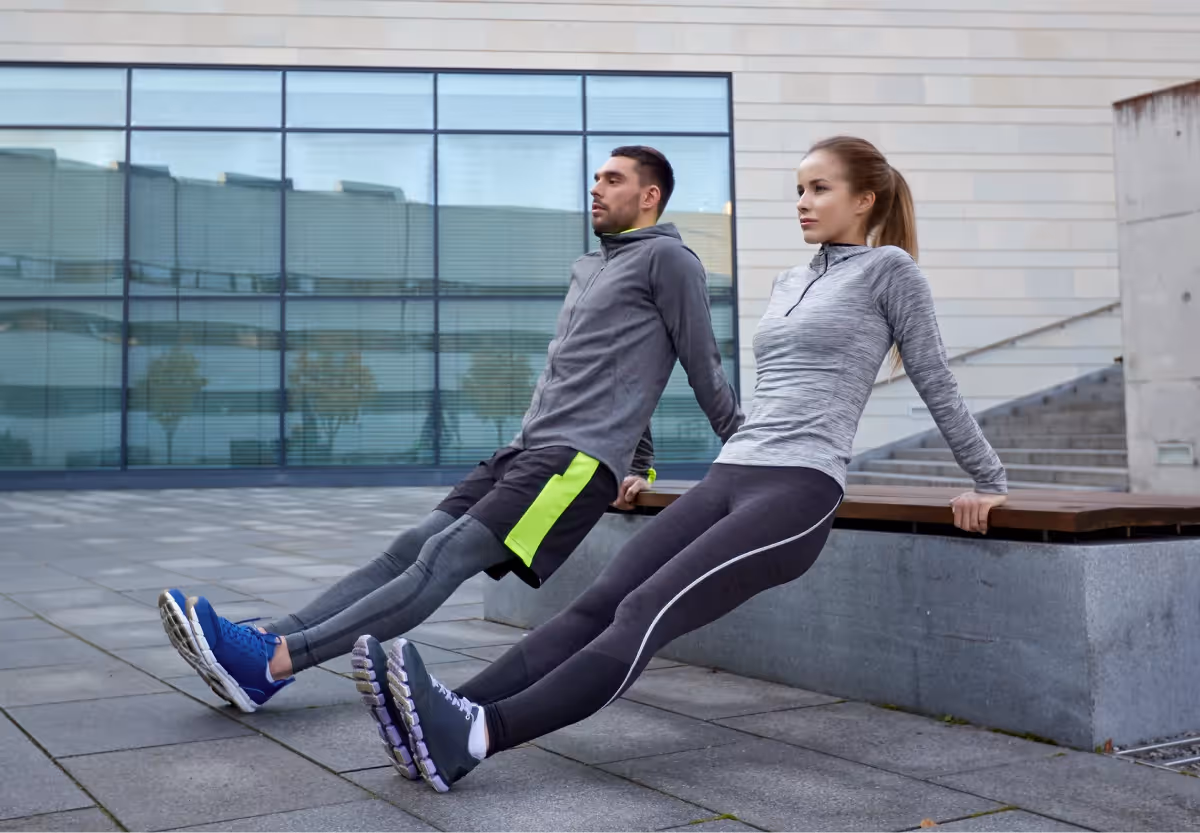 two people doing bench dips