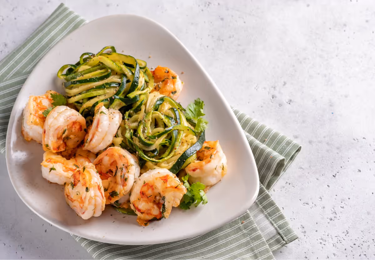 a plate of shrimp and zucchini