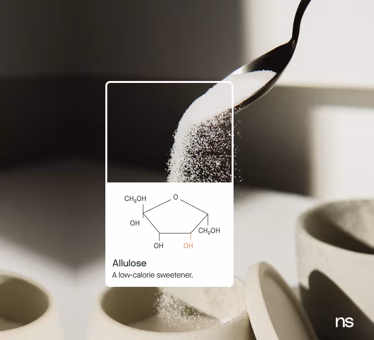 photo of allulose with chemical structure layered over