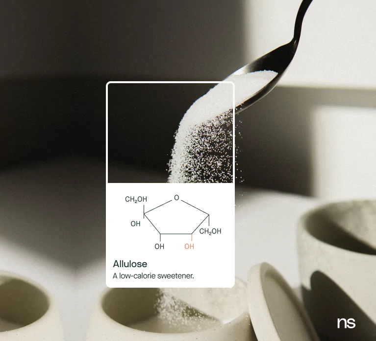 photo of allulose with chemical structure layered over